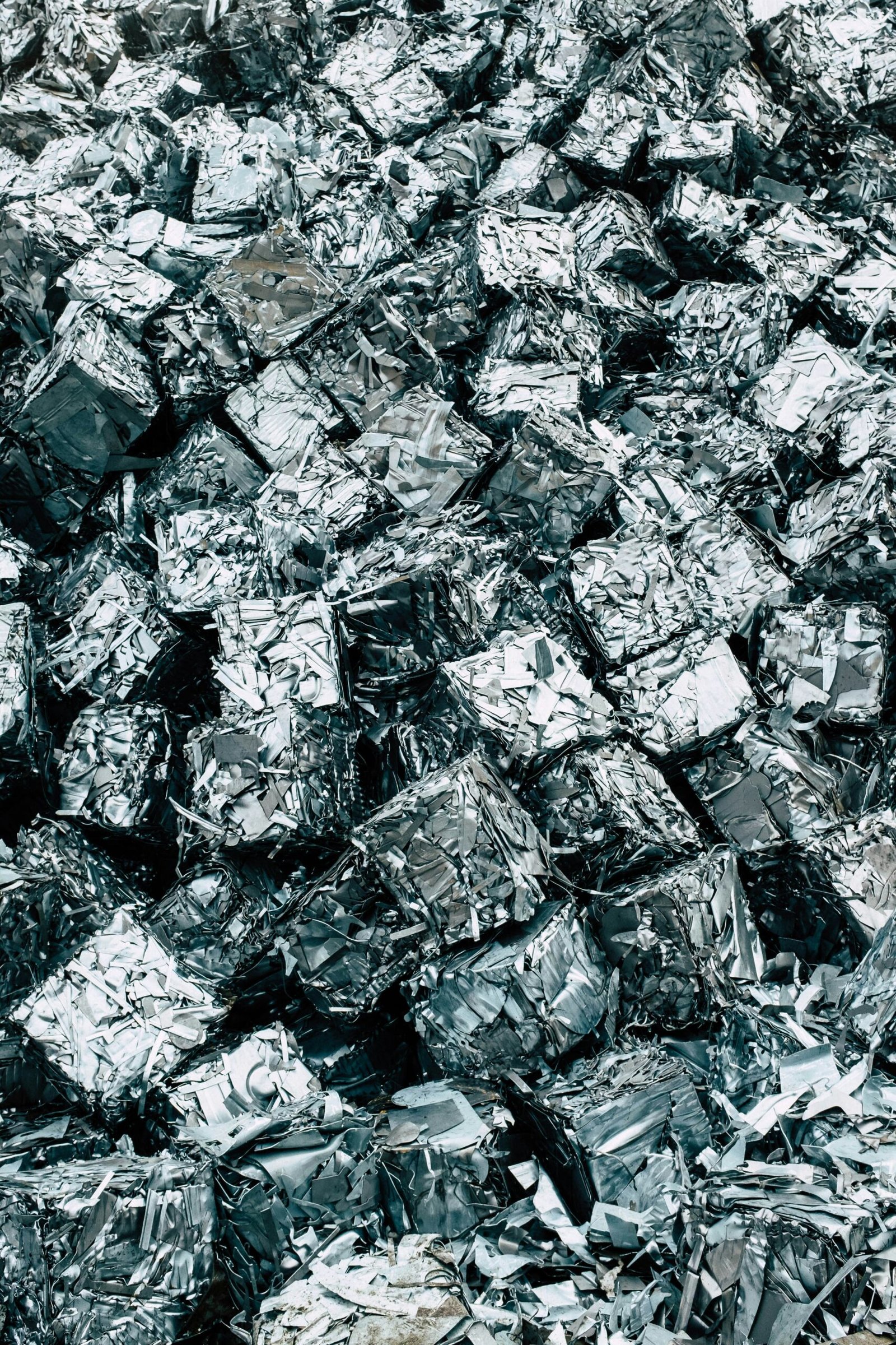 a pile of silver foil sitting on top of a pile of silver foil